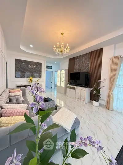 Luxurious living room with elegant chandelier and modern decor