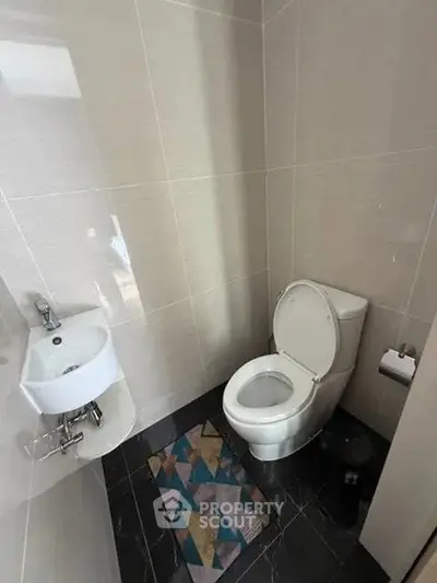 Modern bathroom with sleek fixtures and stylish tile flooring