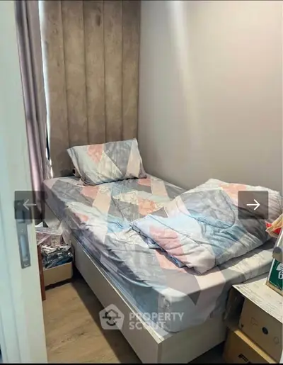 Cozy small bedroom with single bed and modern decor