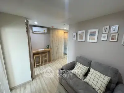 Cozy living room with modern decor and wooden accents in a stylish apartment.