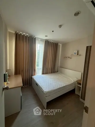 Cozy bedroom with natural light and modern furnishings