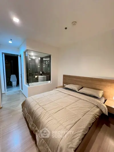 Modern bedroom with ensuite bathroom and stylish wooden accents