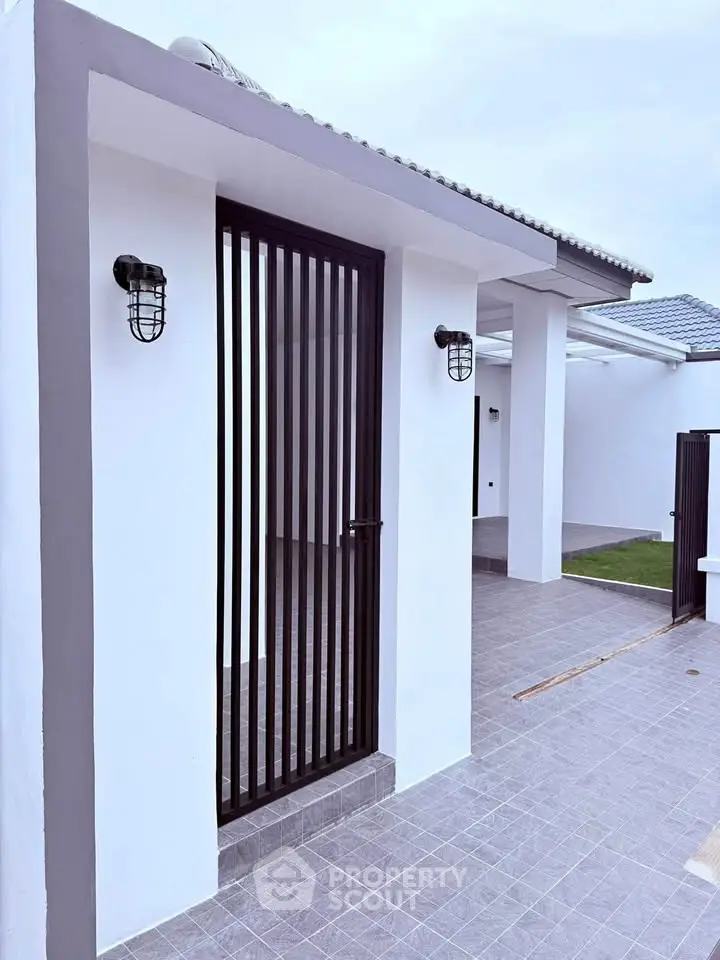 Modern minimalist exterior with sleek lines and stylish lighting, perfect for contemporary living.