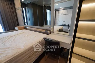 Modern bedroom with stylish decor and built-in storage solutions.