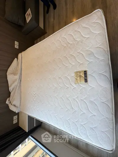 Spacious bedroom with a comfortable mattress and modern decor