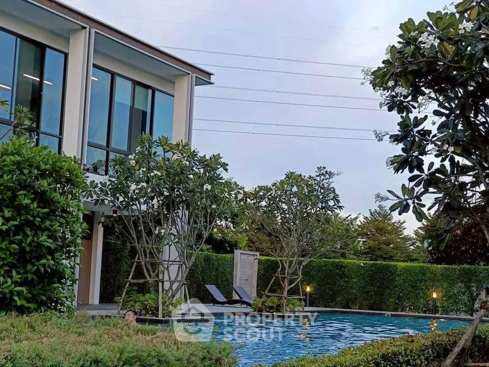 Luxurious modern home with private pool and lush garden, perfect for relaxation and entertainment.