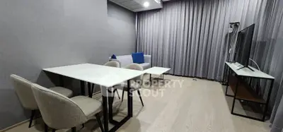Modern living room with sleek furniture and neutral tones, perfect for stylish urban living.