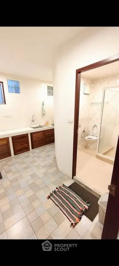 Spacious bathroom with modern fixtures and a large bathtub