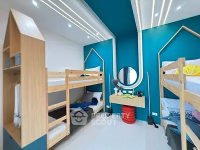 Modern bedroom with bunk beds and stylish decor, perfect for maximizing space and comfort.