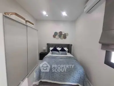 Cozy bedroom with modern decor and ample storage space
