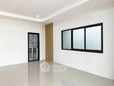 Spacious modern interior with sleek glass doors and large windows, perfect for customization.