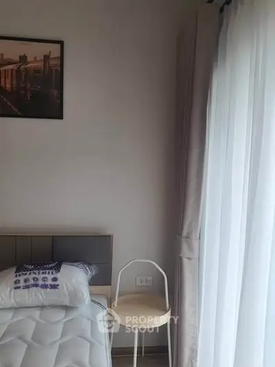 Cozy bedroom corner with natural light and modern decor