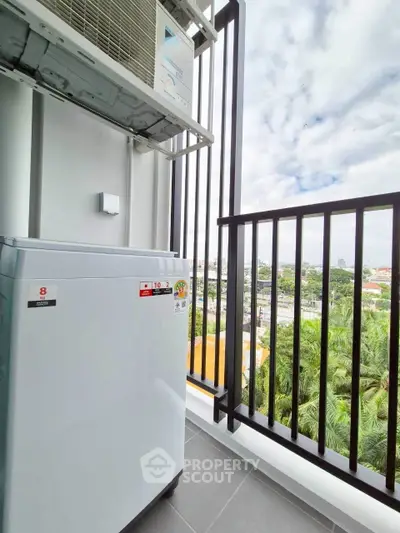 Modern balcony with city view and air conditioning unit, perfect for urban living.