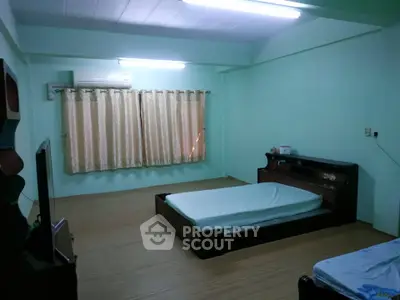 Spacious bedroom with minimalist design and natural light
