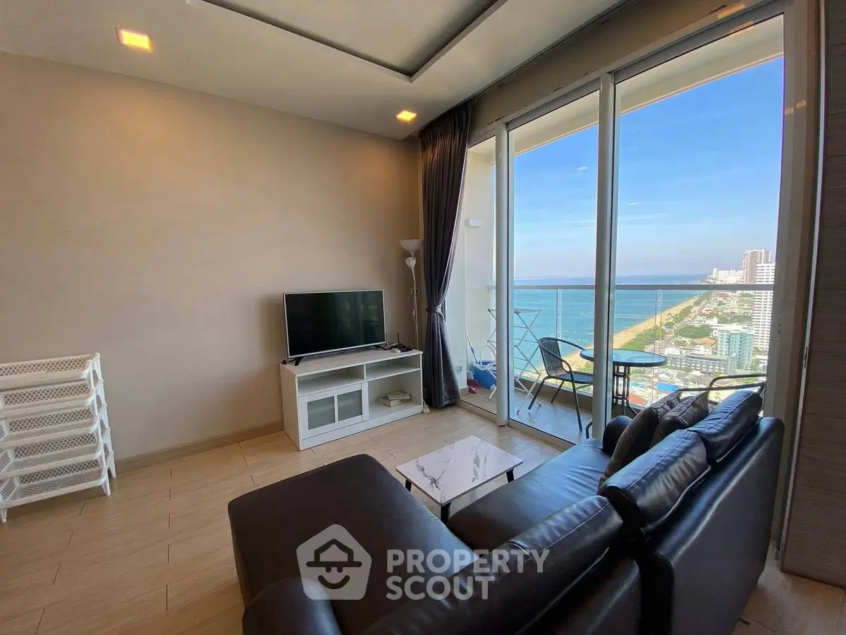 Modern living room with ocean view and large balcony in luxury apartment