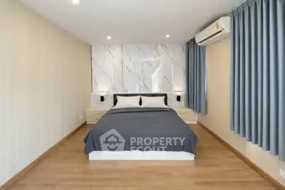 Modern bedroom with stylish decor and air conditioning