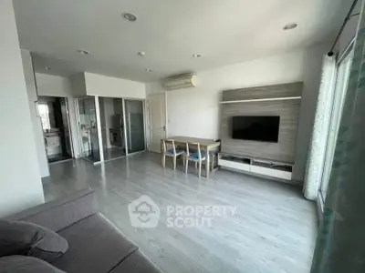 Spacious modern living room with sleek design and natural light