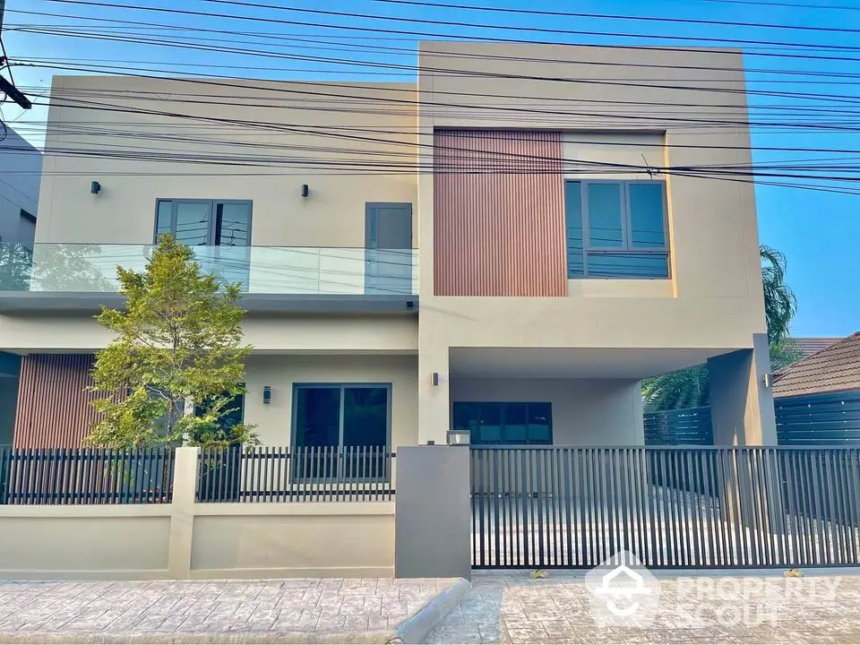 Modern two-story house with sleek design and spacious driveway