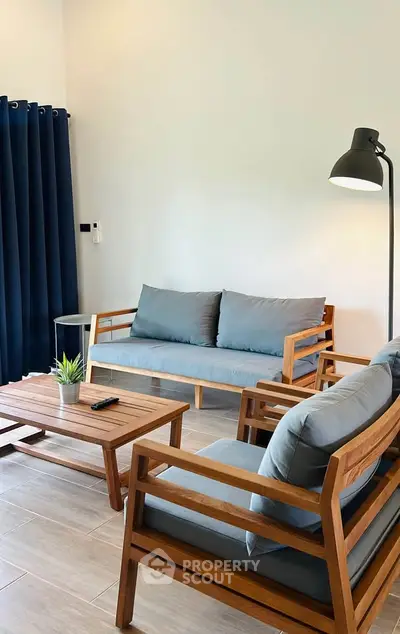 Modern living room with wooden furniture and stylish decor