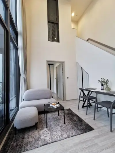 Modern duplex living room with high ceilings and stylish furniture