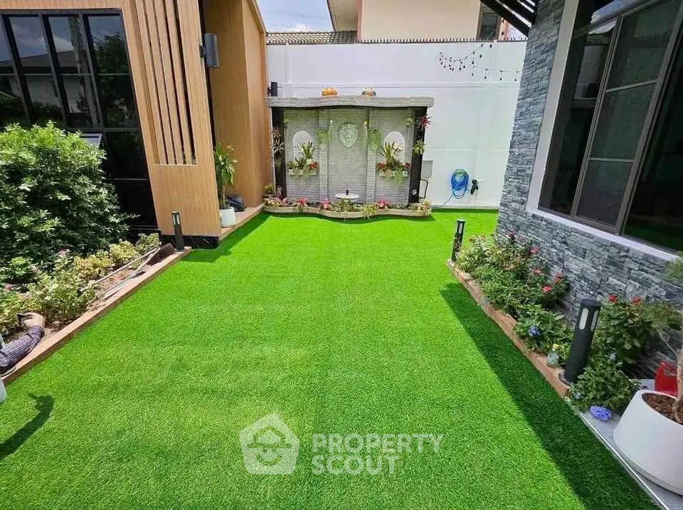 Beautiful garden with lush green lawn and modern landscaping