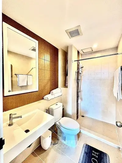 Modern bathroom with sleek fixtures and walk-in shower