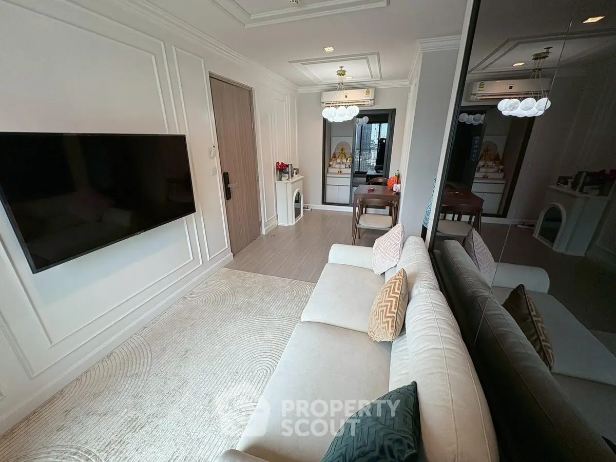 Modern living room with elegant decor and wall-mounted TV