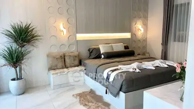 Luxurious modern bedroom with elegant decor and ambient lighting