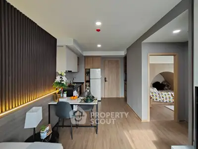 Modern open-plan living room with stylish decor and cozy dining area