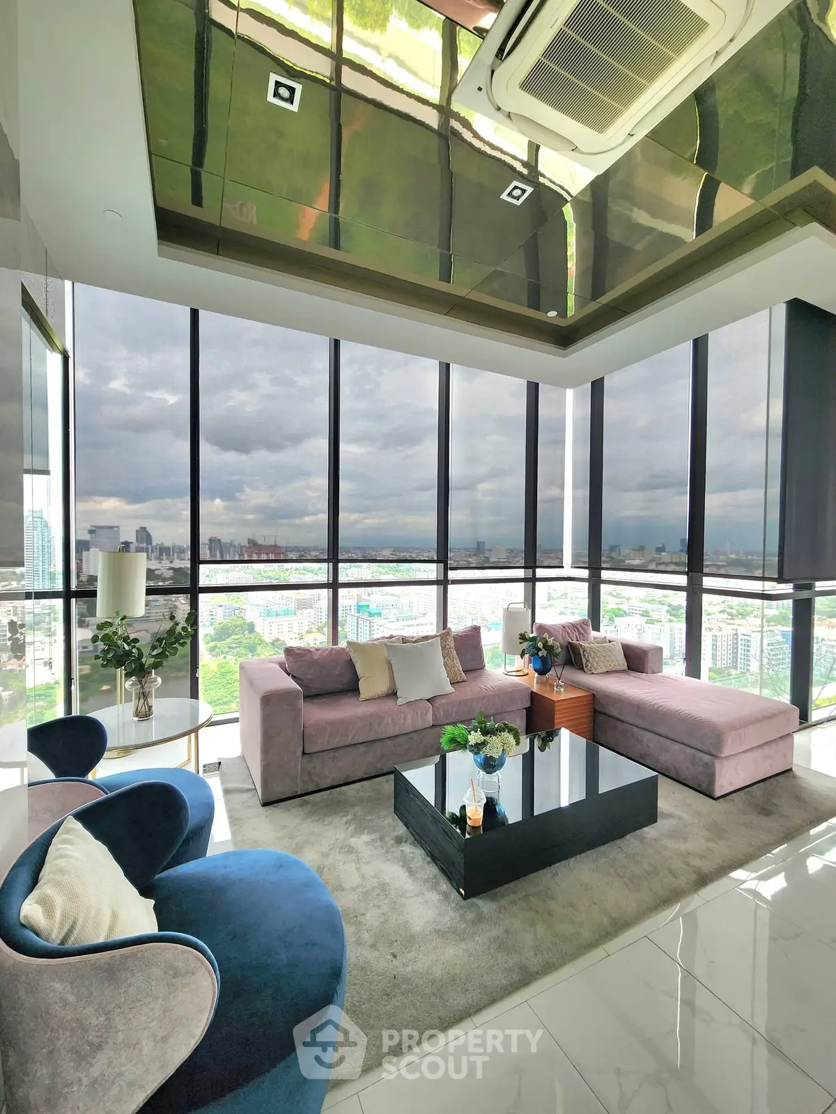 Luxurious living room with panoramic city views and elegant modern furnishings.