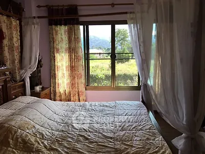 Cozy bedroom with floral curtains and scenic window view