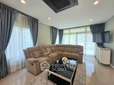 Spacious modern living room with elegant curtains and cozy sectional sofa