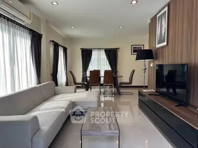 Modern living room with sleek furniture and natural light