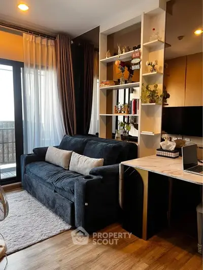 Stylish living room with modern decor and cozy seating in a contemporary apartment.