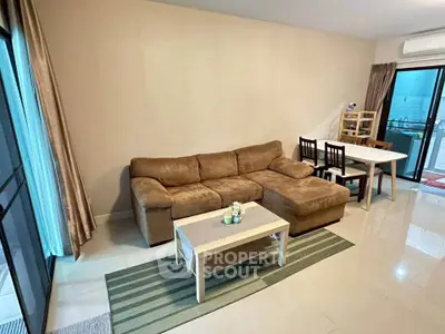 Spacious living room with cozy brown sofa and modern decor