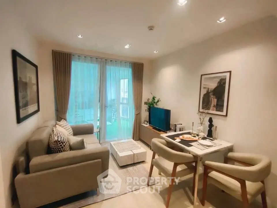 Cozy living room with modern decor and balcony view, perfect for relaxation.