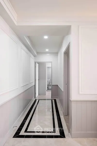 Elegant hallway with modern design and stylish paneling in a residential property.