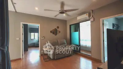 Spacious living room with modern decor and natural light