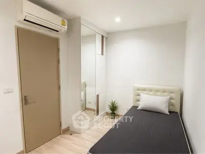 Modern minimalist bedroom with air conditioning and sleek wardrobe