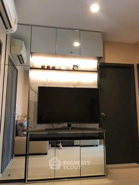 Modern living room with sleek TV unit and stylish storage cabinets