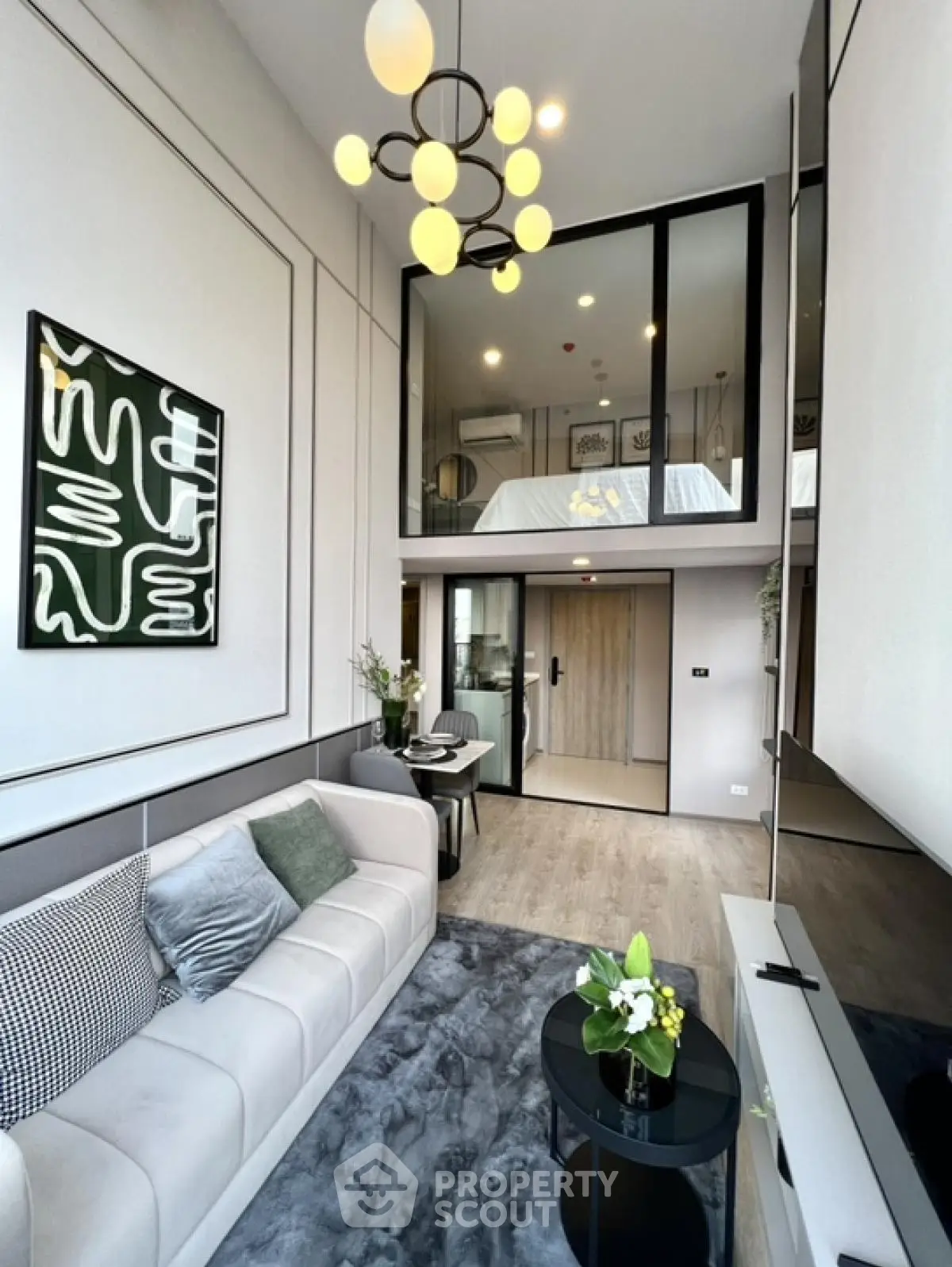 Modern loft-style living room with high ceilings and chic decor