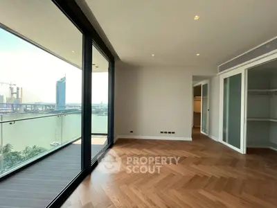 Spacious corner unit with stunning river view and large balcony, featuring elegant wooden flooring and ample natural light.