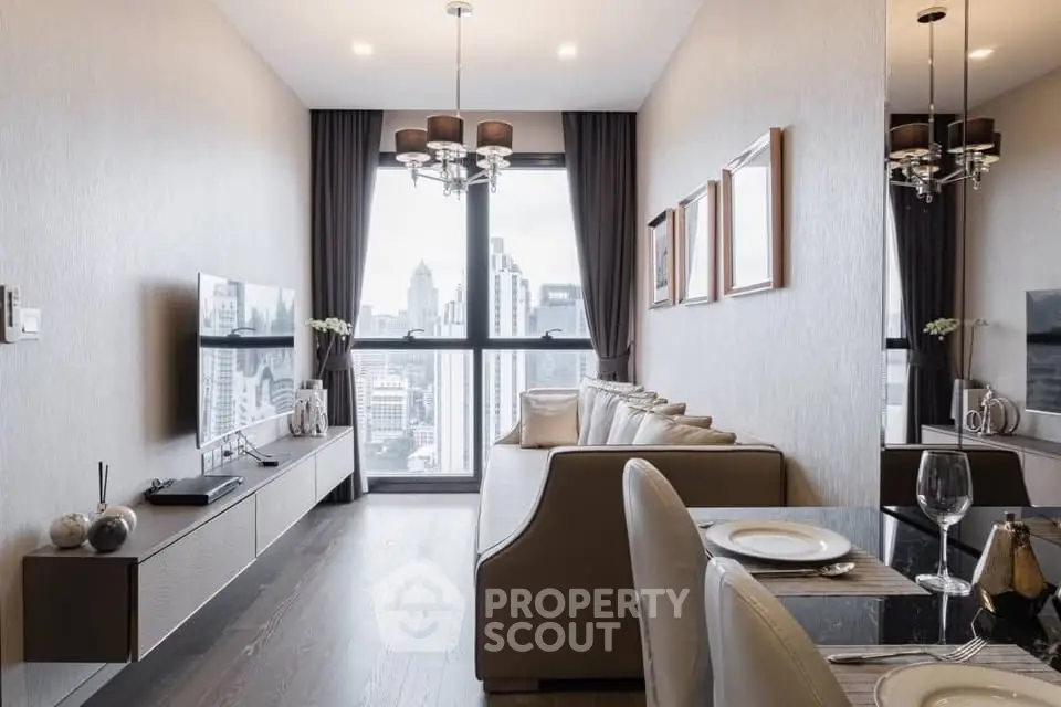 Modern living room with city view, elegant decor, and stylish furniture in a high-rise apartment.