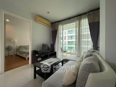 Modern living room with cozy sofa and balcony view in a stylish apartment