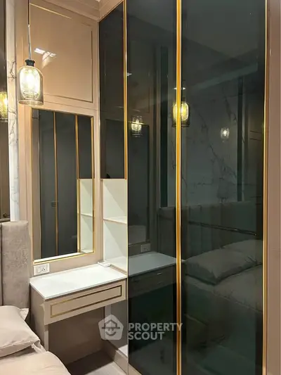 Luxurious bedroom with elegant mirrored wardrobe and cozy lighting
