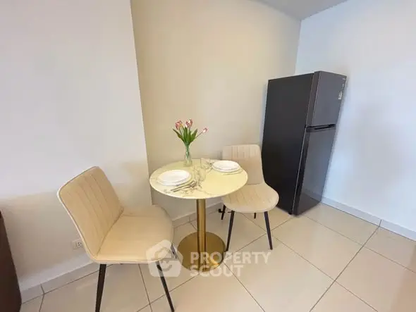 Cozy dining nook with elegant marble table and modern chairs in a bright kitchen corner.