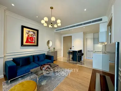 Elegant living room with modern decor and open kitchen layout