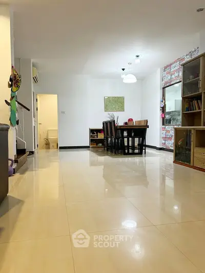 Spacious living room with dining area and modern decor