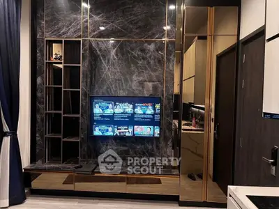 Luxurious modern living room with sleek marble wall and built-in TV unit, perfect for entertainment.