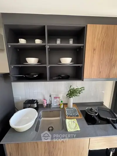 Modern kitchen with open shelving and sleek design